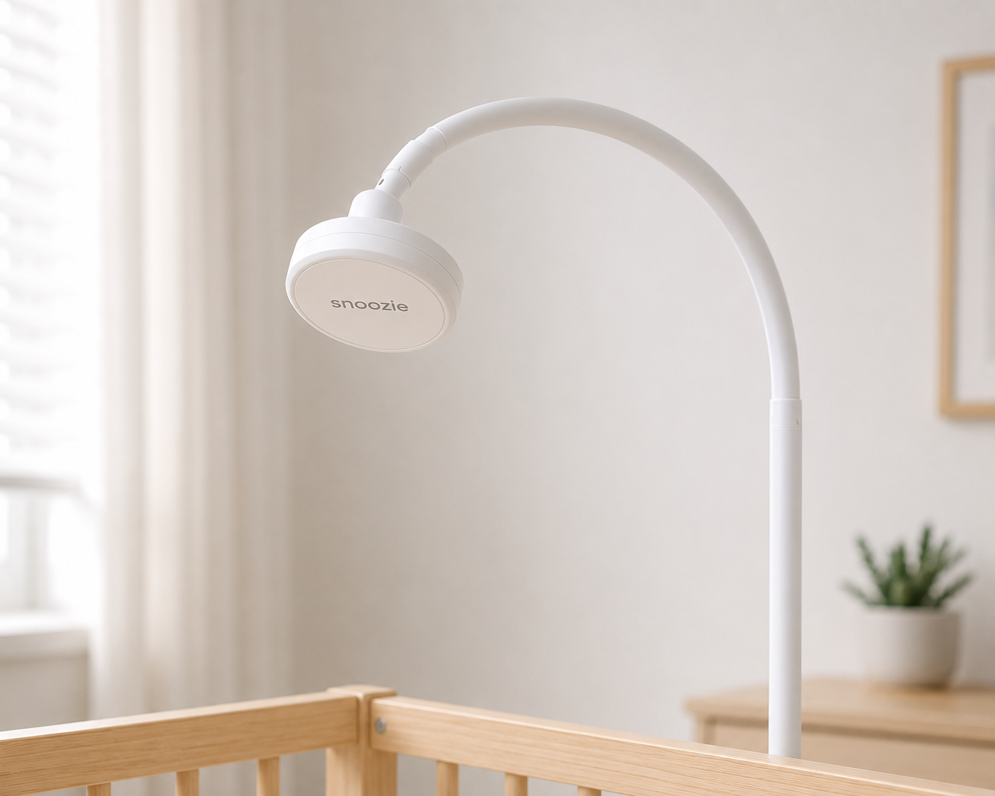Snoozie wireless baby sleep tracker on its floor stand